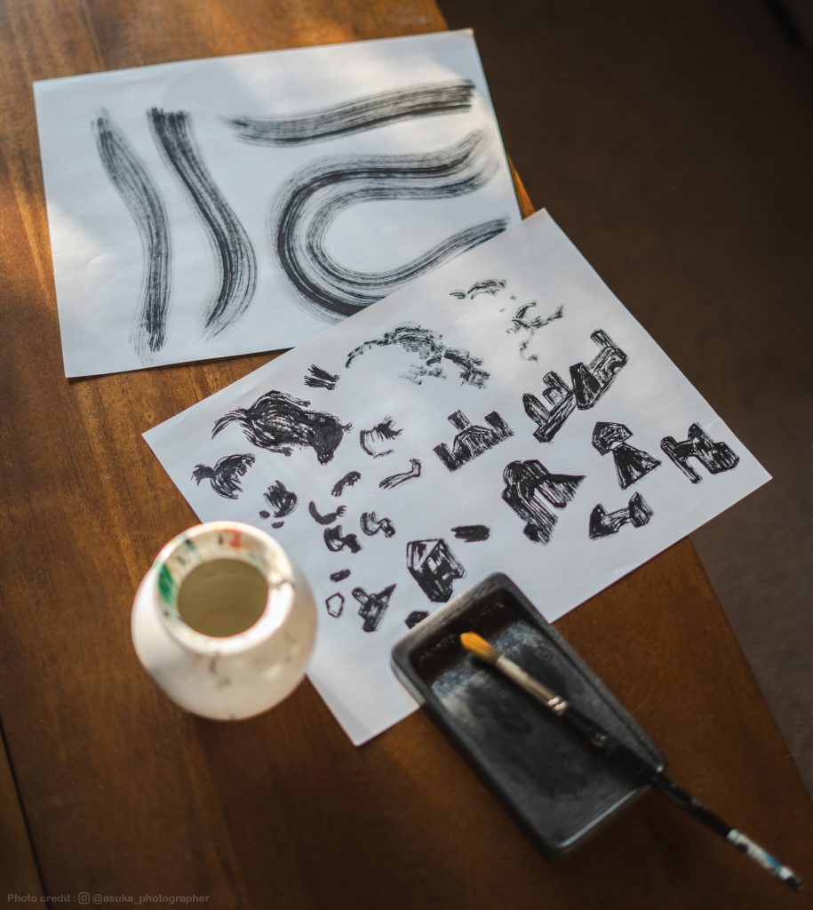 A close-up of some of Shiho's semi ink drawing on her desk.