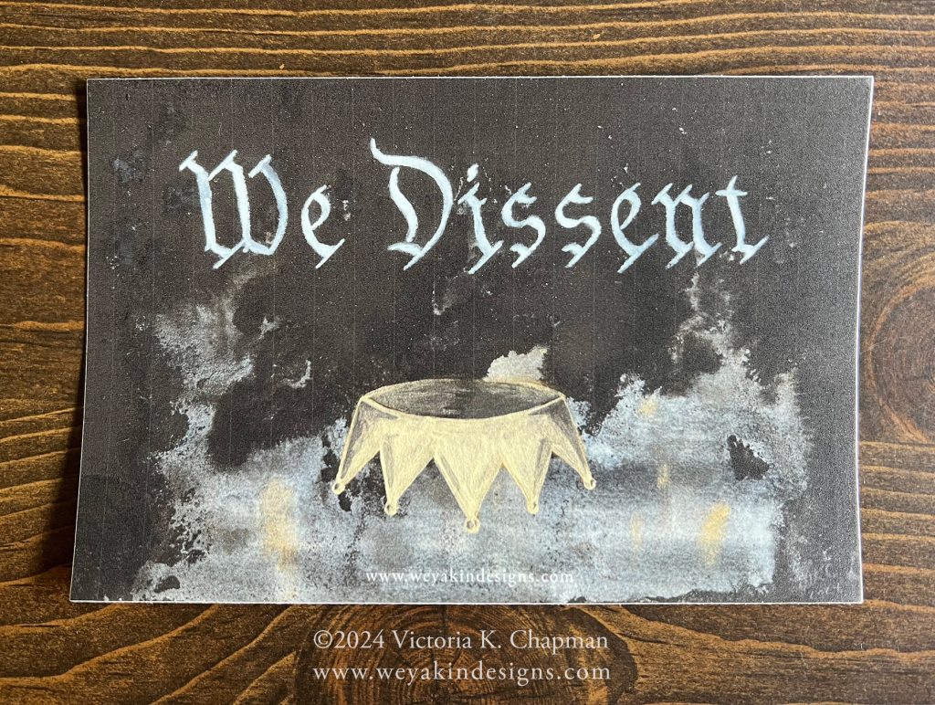 A sticker of the "We Dissent" image. A dark piece of art with an upside down golden crown.